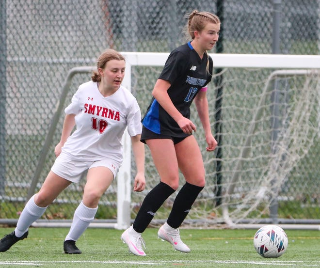 Smyrna's Hailey Rosan pursues Middletown's Gabriella Riley in the first half of the Cavaliers' 5-0 win at Middletown, Thursday, March 28, 2024.