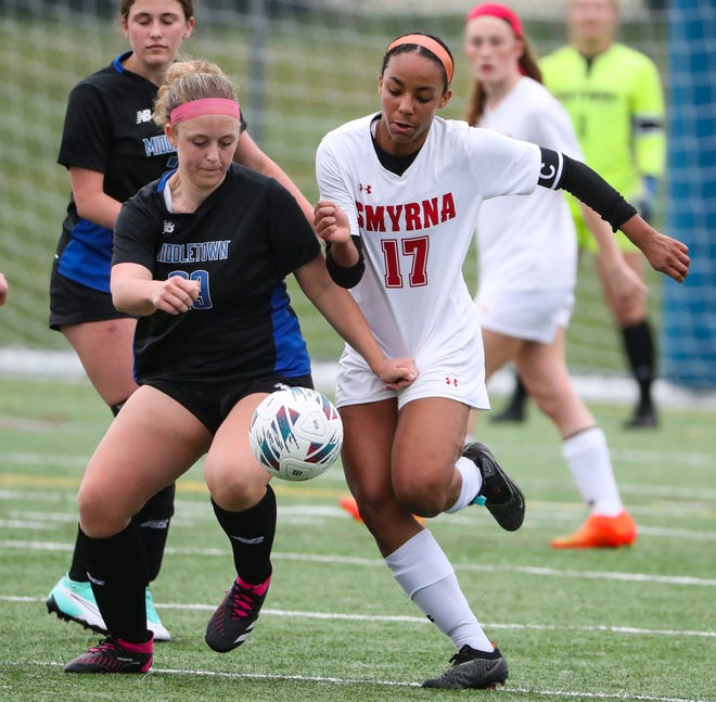 Middletown's Linley Howard (left) moves against Smyrna's Desiree Zapata in the first half of the Cavaliers' 5-0 win at Middletown, Thursday, March 28, 2024.