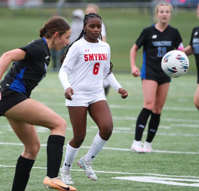 Smyrna's Aleisa Clarke watches as the ball is advanced by Middletown's Mia Kolbjornsen in the first half of the Cavaliers' 5-0 win at Middletown, Thursday, March 28, 2024.