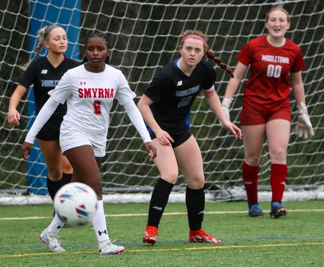 Smyrna's Aleisa Clarke (6) and Middletown's Riley Carey watch the ball in the first half of the Cavaliers' 5-0 win at Middletown, Thursday, March 28, 2024.