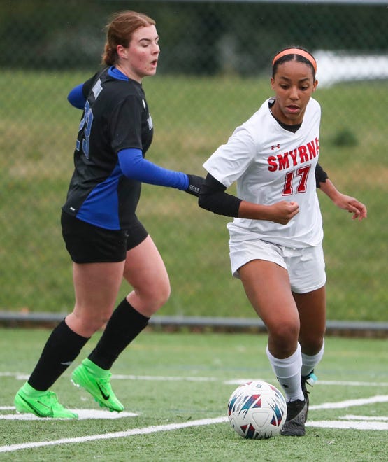 Middletown's Breanna Brown (left) defends as Smyrna's Desiree Zapata controls the ball in the first half of the Cavaliers' 5-0 win at Middletown, Thursday, March 28, 2024.