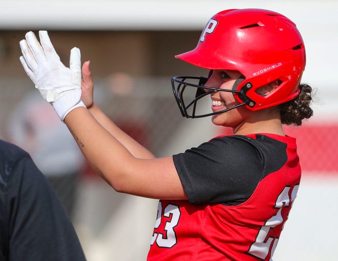 Polytech's Kyla Davis cheers her RBI single as the Panthers get on the board in the fourth inning in Polytech's 8-3 win at Smyrna High School, Thursday, April 18, 2024.