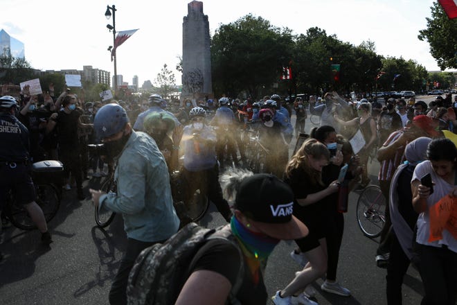 Police spray into a crowd gathered on Benjamin Franklin Parkway in Philadelphia, Pa. to protest police violence on Monday, June 1, 2020.