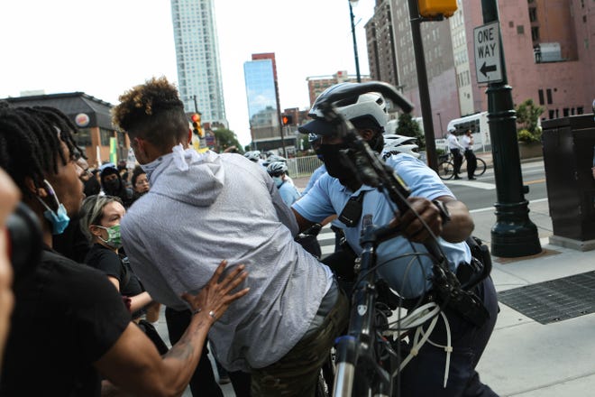 Police and a protestor clash at a march against police violence in Philadelphia, Pa. on Monday, June 1, 2020.