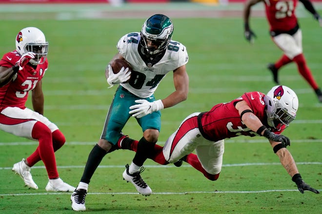 Philadelphia Eagles wide receiver Greg Ward (84) makes a catch as Arizona Cardinals cornerback Byron Murphy, right, defends during the second half of an NFL football game, Sunday, Dec. 20, 2020, in Glendale, Ariz. (AP Photo/Ross D. Franklin)
