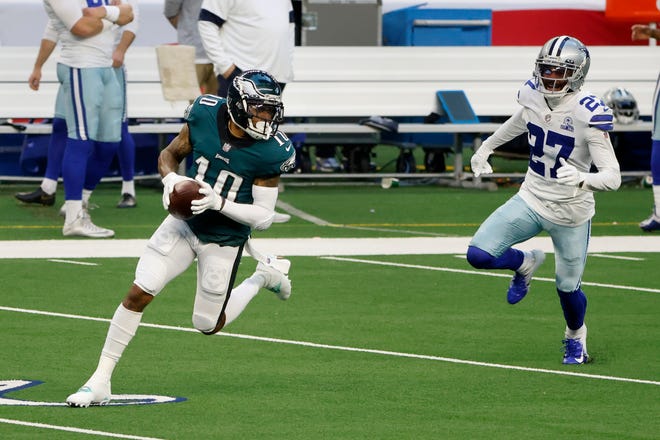 Philadelphia Eagles wide receiver DeSean Jackson (10) runs for a touchdown while being chased by Dallas Cowboys cornerback Trevon Diggs (27) during the first half of an NFL football game in Arlington, Texas, Sunday, Dec. 27, 2020.