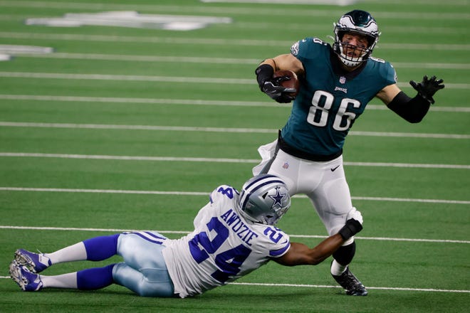 Philadelphia Eagles tight end Zach Ertz (86) is stopped after catching a pass by Dallas Cowboys cornerback Chidobe Awuzie (24) in the second half of an NFL football game in Arlington, Texas, Sunday, Dec. 27. 2020. (AP Photo/Michael Ainsworth)